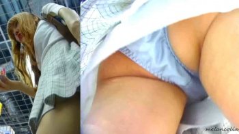【upskirt837逆さ撮りギャル】お買い物中にお尻を突き出してしまいブルーのサテンPを撮られちゃう期待通りのエロさを見せるギャル風お姉さんの画像